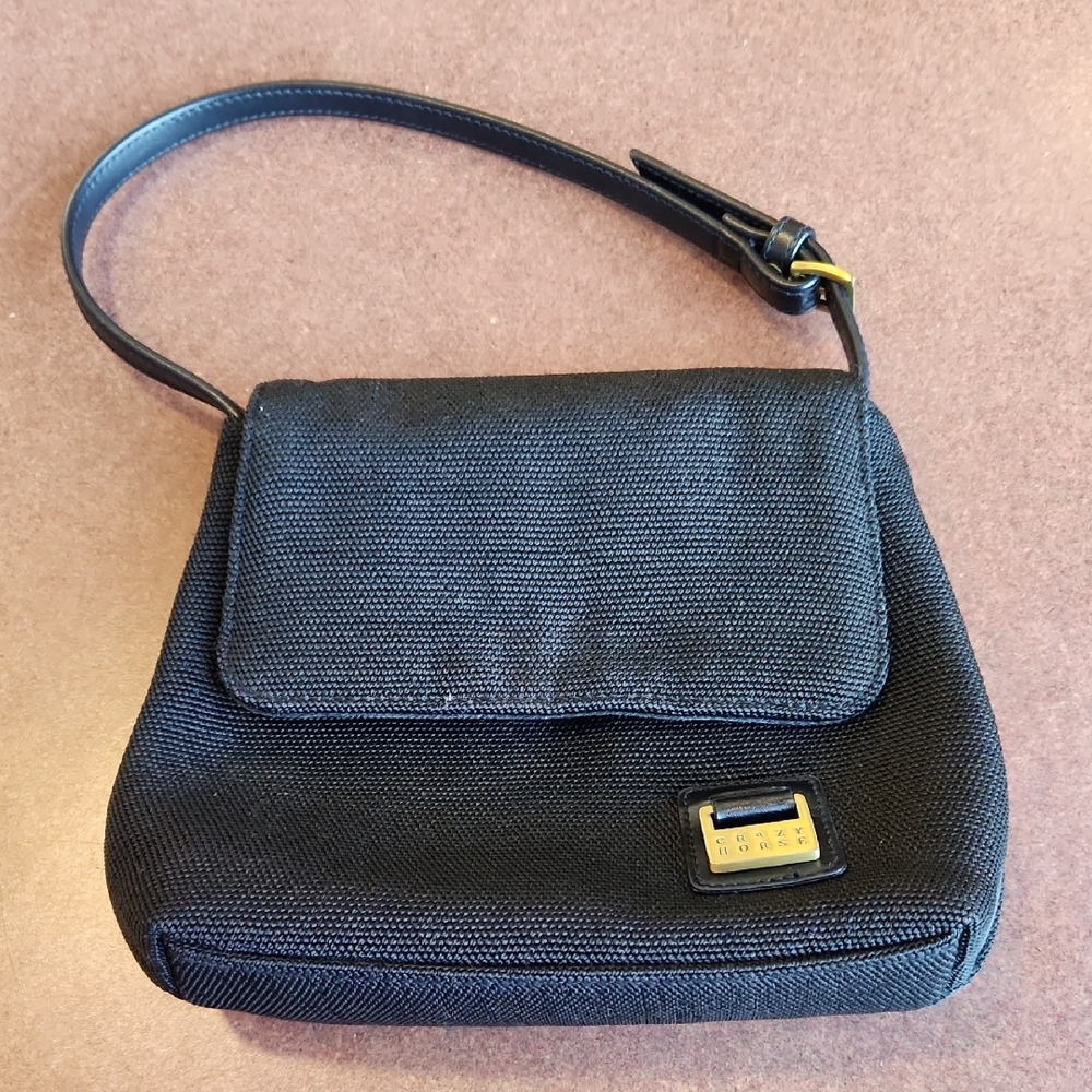Sleek Black Shoulder Bag with Gold Hardware